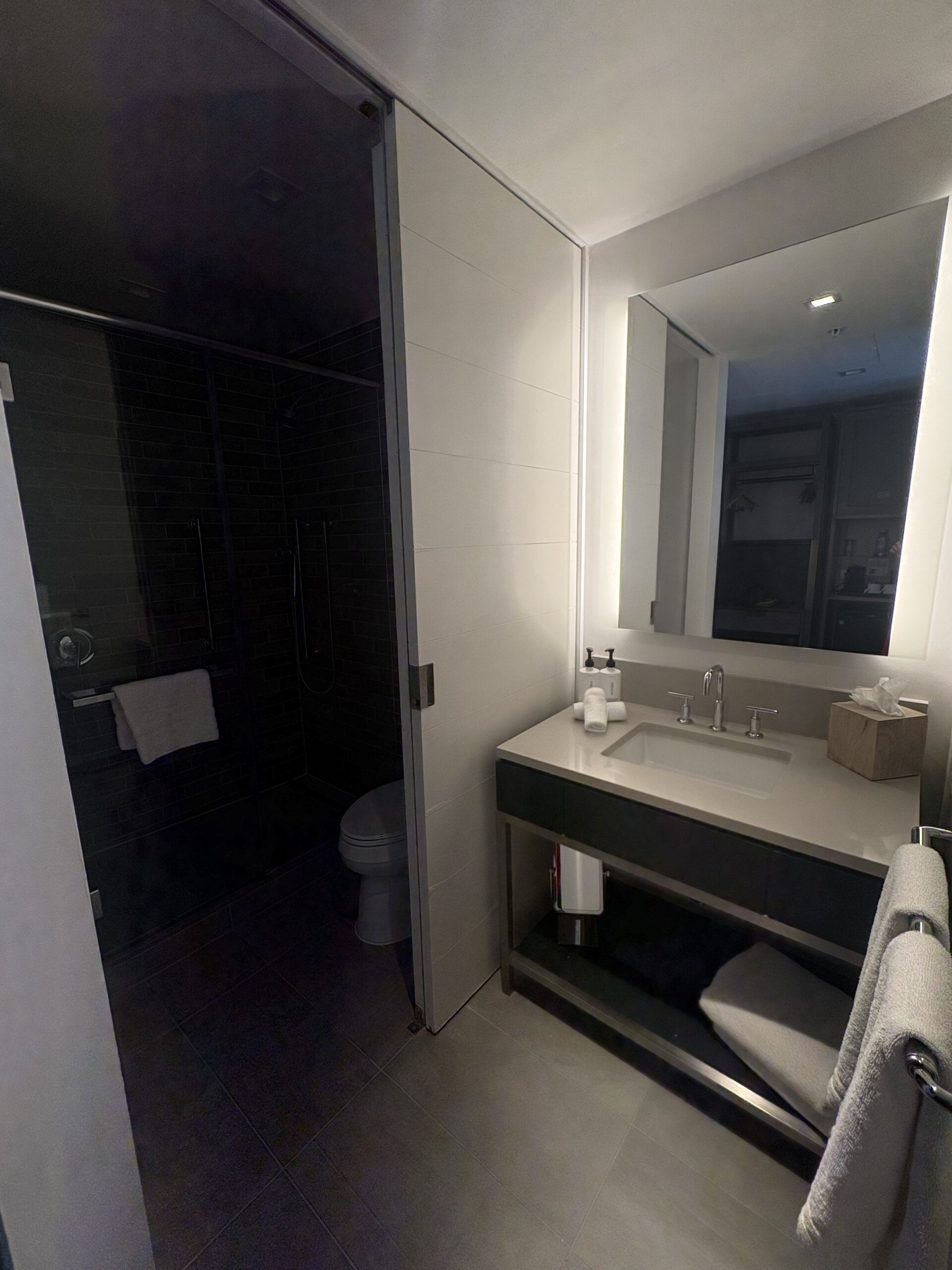 Bathroom vanity with backlit mirror at Canopy by Hilton Washington DC The Wharf