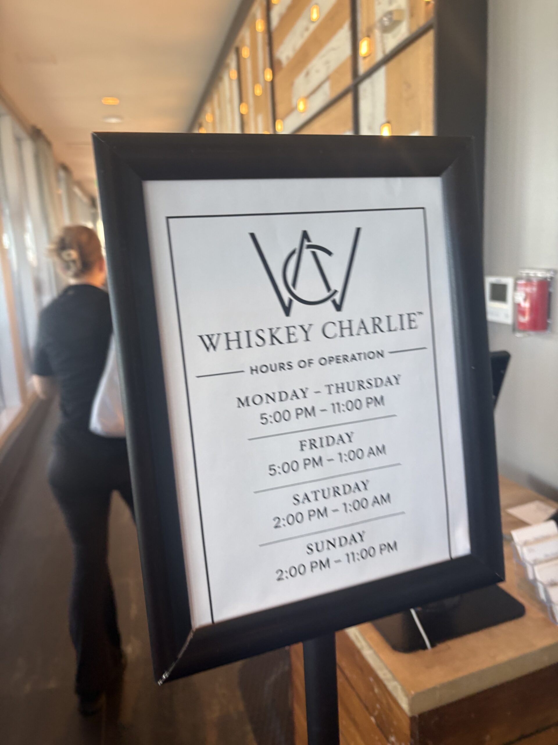 Whiskey Charlie rooftop bar hours of operation sign at Canopy by Hilton Washington DC The Wharf