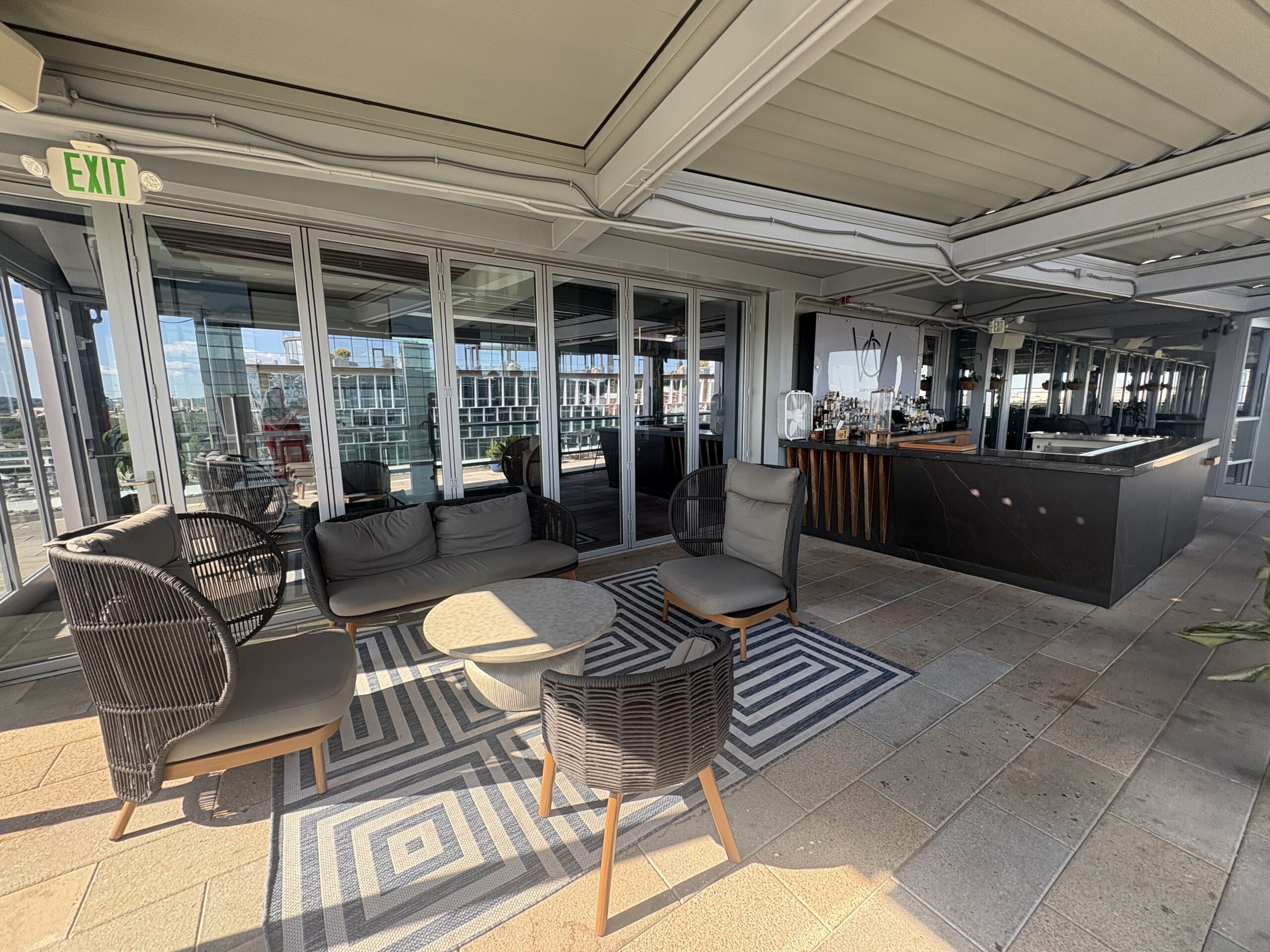 Black marble bar counter at Whiskey Charlie rooftop bar, Canopy by Hilton Washington DC The Wharf